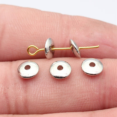 Bright Silver Round Disc Spacer Bead shown in hand