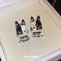Black and White Cat Stud Earrings with Striped Bodies and Gold Details view 2