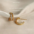 Gold Tone Double Loop Huggie Hoop Earrings With Clear Stones view 3
