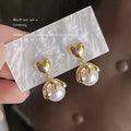 Gold-Tone Heart Stud Pearl Drop Earrings with Wave Frame view 1
