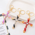 Cat Eye Rhinestone Cross Keychain Gold Clasp Red Pink Black view 1