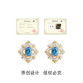 Gold Tone Geometric Halo Blue Oval Stone Stud Earrings view 3