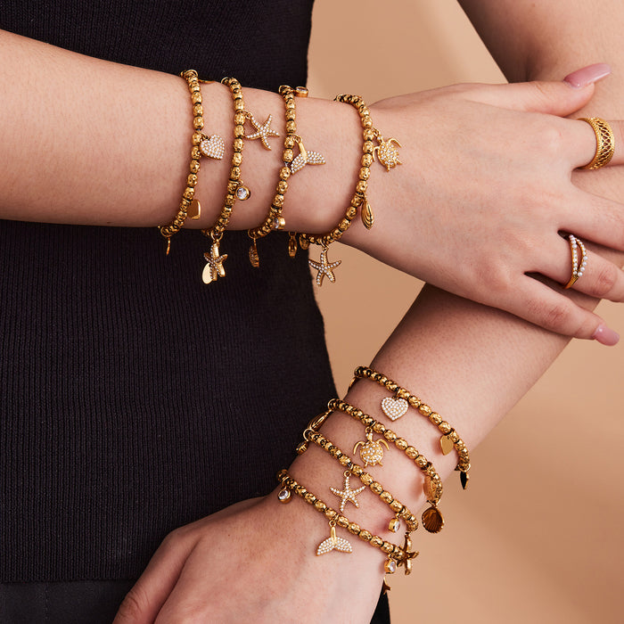 Marine and Heart Crystal Charm Bracelets in Gold Tone