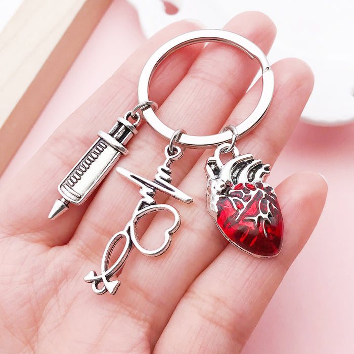 Stethoscope and Syringe Charm Keychains Featuring Red Heart Across 16 Pictured Variations