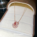 Red Crystal Swan Pendant Necklace in Rose Gold Tone view 1