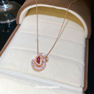 Red Crystal Swan Pendant Necklace in Rose Gold Tone