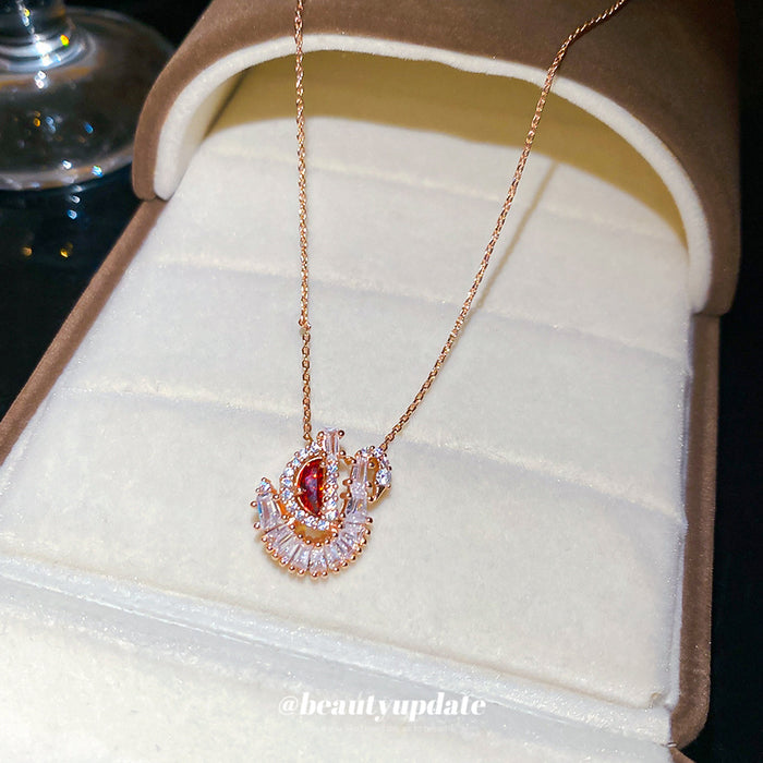 Red Crystal Swan Pendant Necklace in Rose Gold Tone