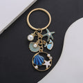 Blue and Pink Shell Dolphin Mermaid and Starfish Keychains view 4