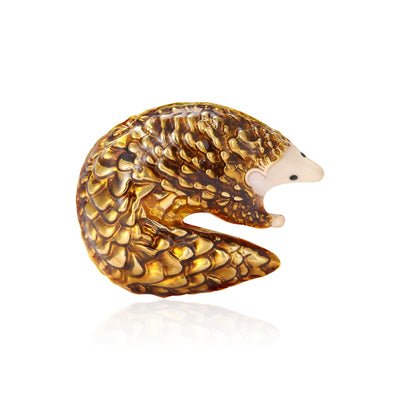 A curled pangolin with a textured scale pattern shown on a white background