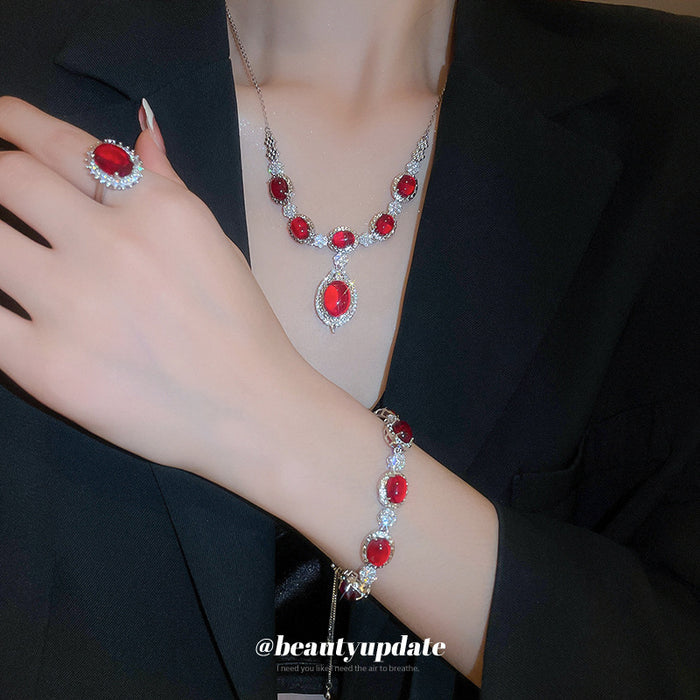 Silver Tone Red Oval Crystal Necklace And Ring With Clear Halos