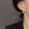 Gold Geometric Ribbed Twist Huggie Hoop Earrings Pair view 2