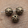 Swirl Pattern Round Spacer Beads in Two Antique Finishes view 4