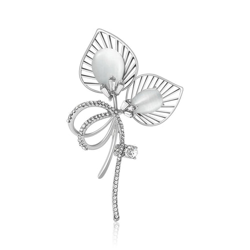 Silver cat-eye dual leaf brooch rhinestone bow on white background