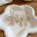 Pink Iridescent Bow Dangle Earrings With Gold Tone Hooks view 6
