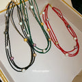 Layered Bead and Pearl Necklaces in Three Cord Colors view 1