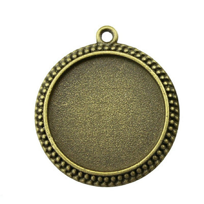 Beaded Edge Round Cabochon Pendant Trays in Two Finishes shown in image 1 with a simple dotted rim