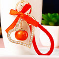 Jeweled Heart Frame Persimmon Keychain with Red Bow and Gold Tone Hardware view 2