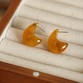 Amber Resin Teardrop Stud Earrings Glossy Curved Shape view 4
