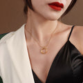 Twisted Cross Circle Ring Pendant Necklace In Gold Or Steel view 1