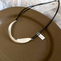 Curved Metal Bib Cord Necklace with Distinctive Textured Details view 7