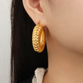 Gold Ribbed Twisted Hoop Earrings Gold And Steel Finishes view 1