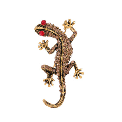 Front product view of the gecko brooch pin in gold