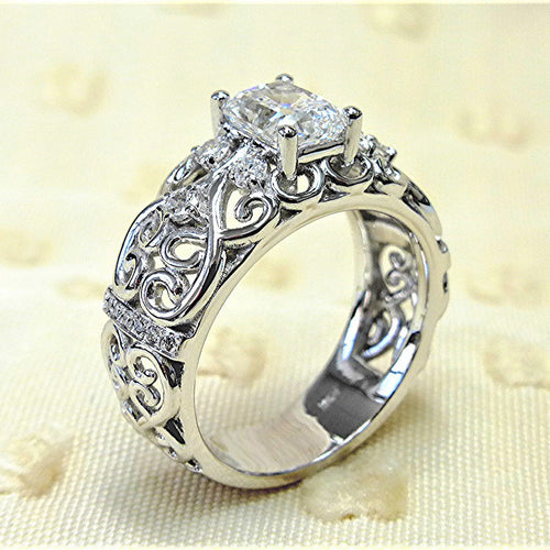 White gold filigree CZ ring side angle showing openwork band