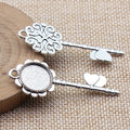 Ornate Key Shaped Round Cabochon Tray Metal Pendants view 2