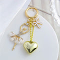 Puffy Heart Charm Keychain with Bow, Cross, and Clover Designs view 8