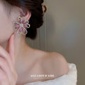 Pink Crystal Open Flower Statement Earrings With Polished Metal Tone Details view 4