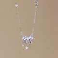Silver Tone Crystal Bow Pendant Necklace With Dangles view 6
