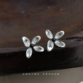 Silver Tone Clear Four Petal Flower And Black Center Stud Earrings view 1