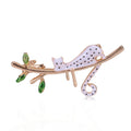 White Enamel Spotted Cat Brooch Gold Branch Green Leaves view 1