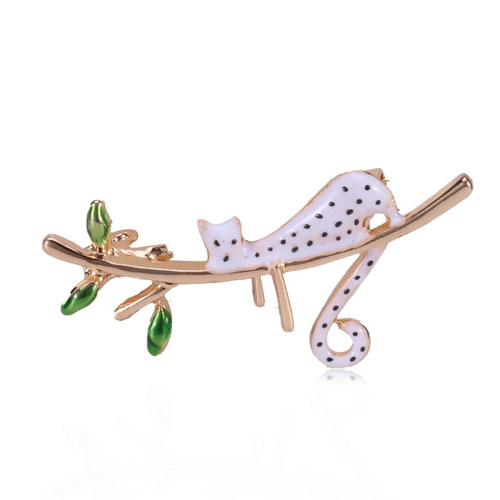 White Enamel Spotted Cat Brooch Gold Branch Green Leaves