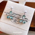 Pearl And Crystal Flower Drop Earrings With Polished Metal Details view 4