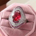 Red Teardrop Stone Silver Tone Swirl Halo Ring With Clear Crystal Accents view 1