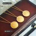 Gold Round Coin Pendant Necklace with Engraved Cherub Angel Motif view 2
