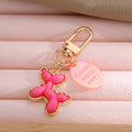 Gold Tone Balloon Dog Clip Keychains with Pearl Collars and English Tags view 10