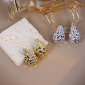 Silver Textured Teardrop Stud Earrings Hollow Hammered view 1
