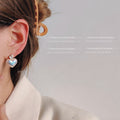 Iridescent Pearl Heart Stud Earrings Gold Crystal Heart Top view 3