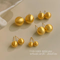 Matte Gold Tone Round Ball Stud Earrings In Five Graduated Sizes view 1