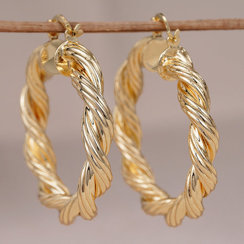 Gold Tone Twisted Rope Large Hoop Earrings Polished Statement Fashion Jewelry displayed from another angle
