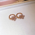 Floral Huggie Hoops And Crystal Flower Studs With Polished Metal Details view 6