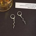 Gold and Silver Tone Wavy Snake Long Dangle Huggie Earrings view 2