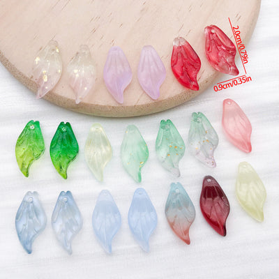Long glass leaf charms with top loops arranged as a full product overview