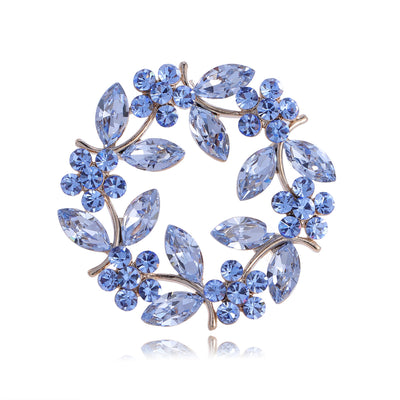 Front product view of the olive branch brooch pin in blue and silver