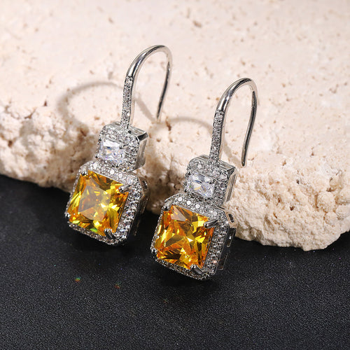 Yellow Square Stone Halo Drop Earrings in Silver Tone, alternate angle.