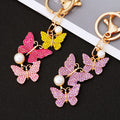 Three Butterfly Drop Keychains in Pink Yellow Purple and White Crystal Palettes view 3