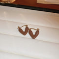 Polka Dot Heart Huggie Hoop Earrings in Brown and Blue view 6