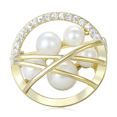 Gold Circle, Silver Circle brooch styles arranged on a light display